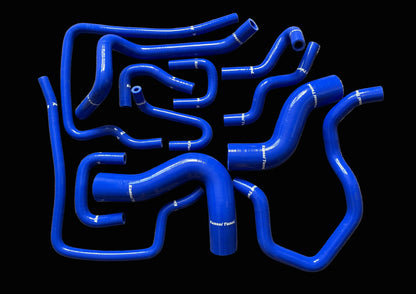 Set of blue silicone hoses on a gray surface