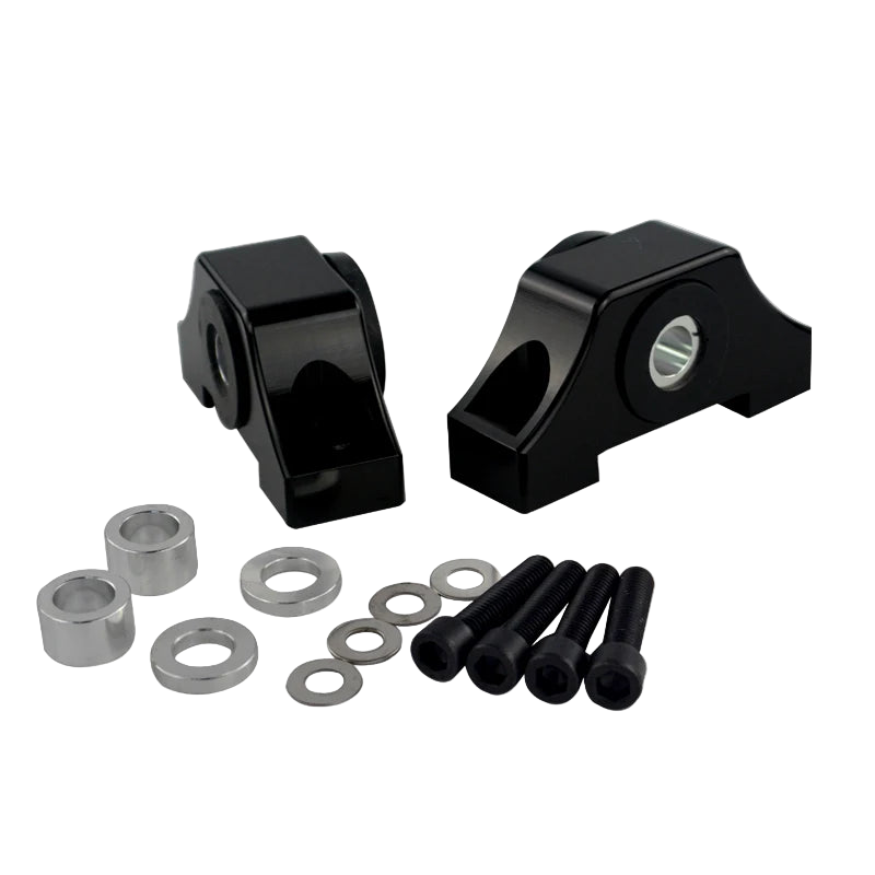 Black mechanical components with washers and bolts on a white background